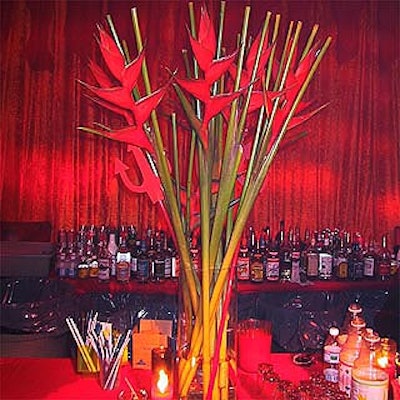 Susan Edgar Design used dramatic--and aptly named--heliconia flowers to complement the devilish decor.