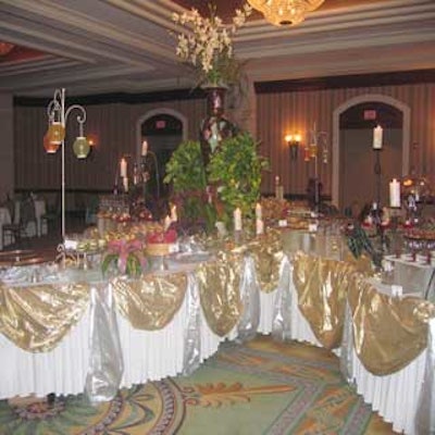 Emeril Lagasse's dessert bar was set with gold and silver linens and enhanced with candlelight.