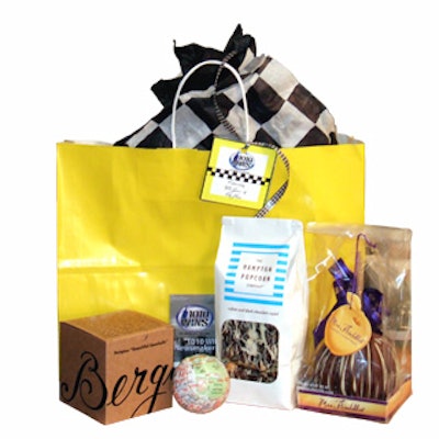 The gift bag for 1010 WINS' 40th anniversary party at Gotham Hall included Bergino souvenir baseballs printed with a map of Manhattan, bags of chocolate-covered popcorn from the Hamptons Popcorn Company, and big chocolate-covered apples from Mrs. Prindable's.