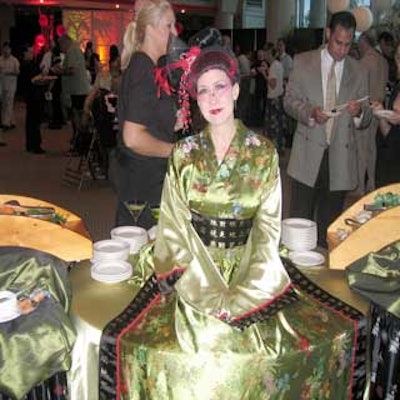 A model dressed in a traditional geisha costume was part of the sushi buffet station.