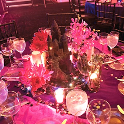 Matthew David Events draped tables in deep purple crushed velvet linens from Cloth Connection.