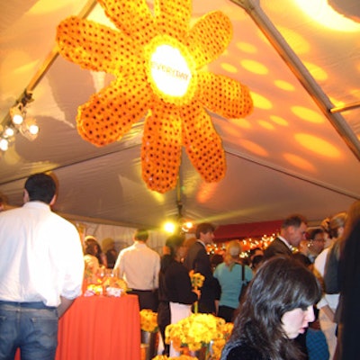 Reader's Digest Association launched Every Day With Rachael Ray with an autumnal event at Café St. Bart's. Roy Braeger hung a giant flower-shaped decor piece covered with yellow and orange gerbera daisies in the center of the tented event.
