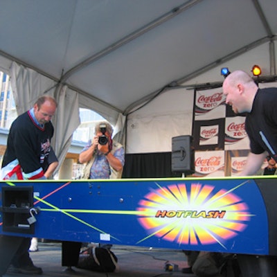 Former Toronto Maple Leaf star Wendel Clark (left) faced off against air hockey pro Daniel Hynes during a promotion for Coca-Cola Zero at Yonge-Dundas Square.