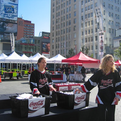Models from Mosaic handed out samples of Coca-Cola Zero to passersby.