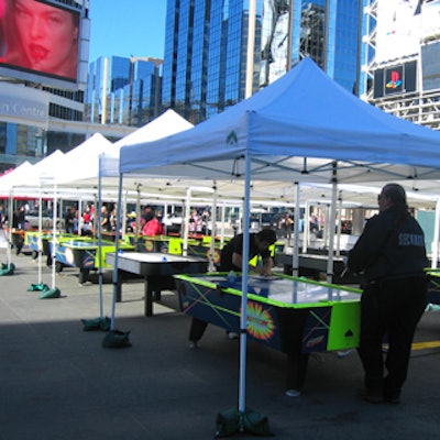 Air hockey tables from Hart Entertainment and Redline Promotions filled the outdoor space at Yonge-Dundas Square.