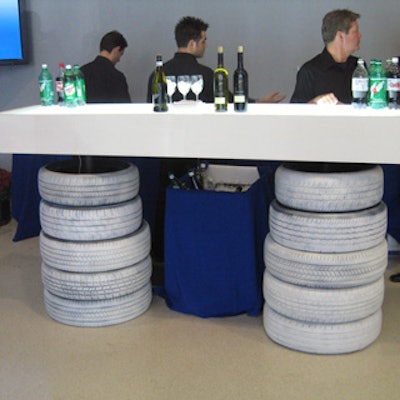 In the center’s atrium space, Modprop.com’s white bar included stacks of tires.