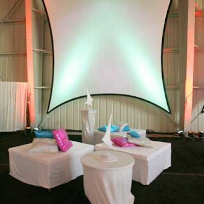 Draped banquettes and tables were used for stark lounge areas.