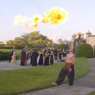 During cocktails guests mingled among fire-eaters and drummers.