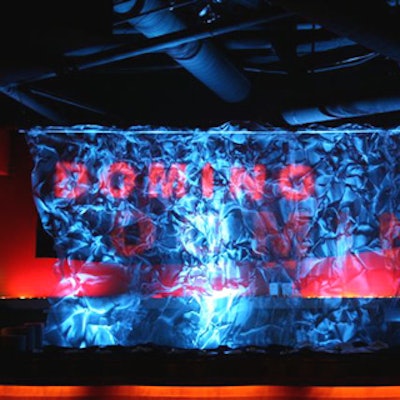 At the Highlands—a cavernous venue totally transformed for New Line Cinema’s all-night premiere party for Domino—a scrim served as a screen for the film's name and clips.