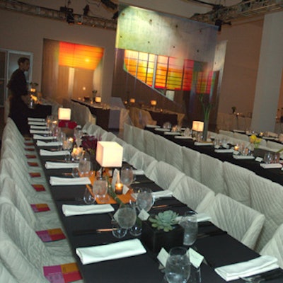 Armani’s design included ivory quilted chair covers and long, rectangular tables.