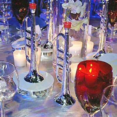 Silver trumpets and silver and white tambourines decorated the tables.