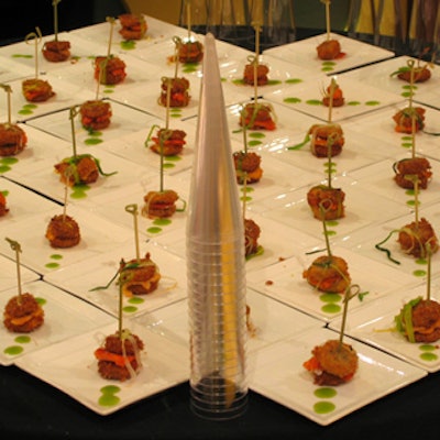 Smoked trout sandwiches were presented with bamboo skewers through them.