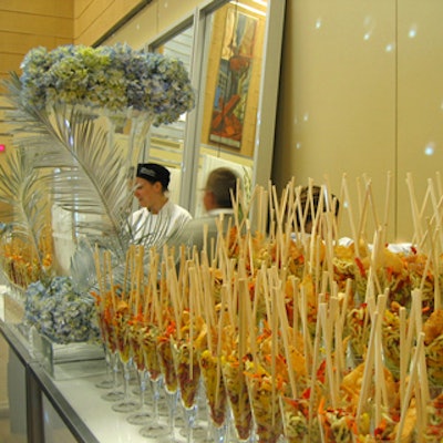 Catered Affare served Asian noodles with wild ginger dressing in tall wineglasses with chopsticks sticking out.