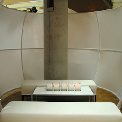 Eventscape formed partially enclosed lounge areas using white spandex as wall material.
