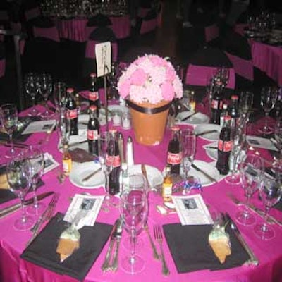 Hot pink and black linens dressed tables, which included cupcake centerpieces from Edda's Cake Designs.