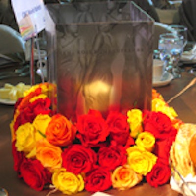 Roses decorated the base of acrylic centerpieces from the Aragon Group that featured images of Diana Ross and the Supremes.