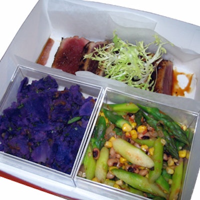 Creative Edge Parties served Southern-style fare in purple boxes. (The photo shows a box prepared for the tasting, with a slightly different menu.)