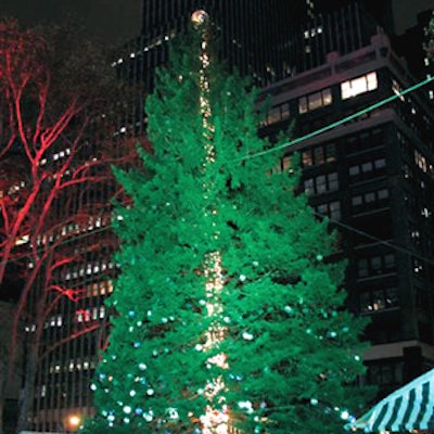 The tree in Bryant Park is decked with 800 silver medallions bearing AIDS awareness slogans.