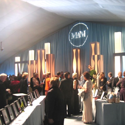 The reception area featured a silent auction in a brightly lit powder blue room.