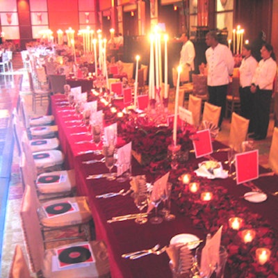 BBJ Linens dressed tables in exuberant red velvets and gold linen.