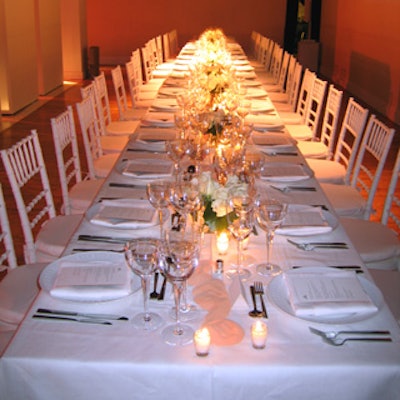 Tentation prepared dinner for 40 guests at a long, white banquet table.