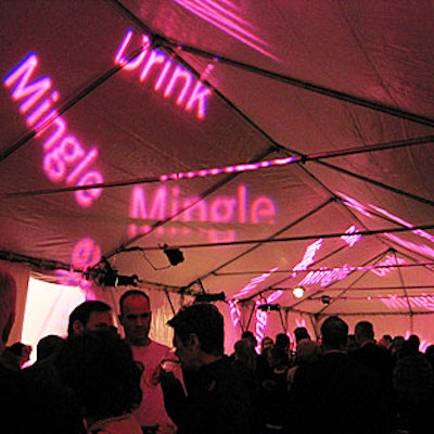 Simple projections signaled different parts of the event—like the “Drink” and “Mingle” projections in the tent for cocktails.