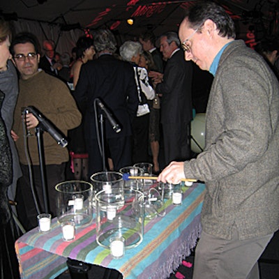 To entertain guests, Miguel Frasconi created soothing sounds with a variety of glass vessels.