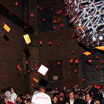 At the end of the evening, hundreds of thank-you notes dropped from the ceiling and billowed over guests.