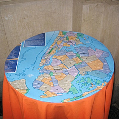 Matthew David Hopkins dotted Bloomberg's reception with cocktail tables covered with orange tablecloths and topped with urban planning maps.