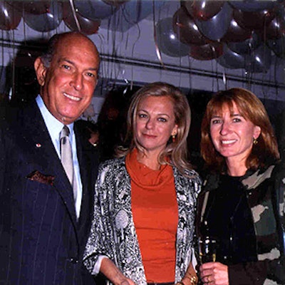 Under balloons provided by Helena Lehane, Oscar de la Renta (left), an unidentified guest and Nicole Miller enjoyed the cocktail reception celebrating La Caravelle's 40th anniversary.