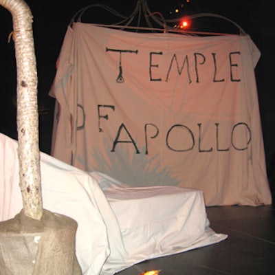 A white cloth-draped structure with handwritten wording that read 'Temple of Apollo' and 'Il Vulcano' to represent Pompeii dominated the center of the room at the beginning of the evening.