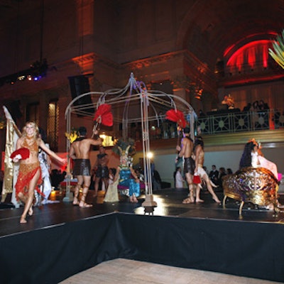 Dancers performed on a platform at the center of the room.