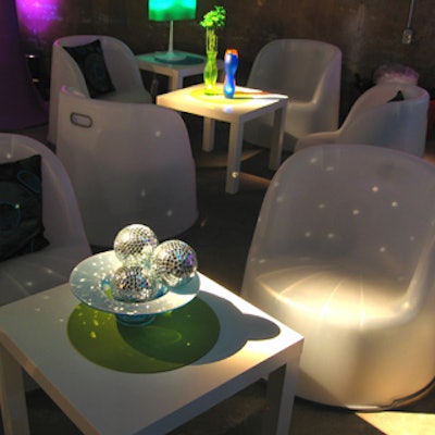 The V.I.P. lounge featured low white chairs and square coffee tables with disco-theme centrepieces.