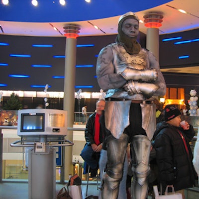 Costumed characters from Statues Alive struck poses prior to the screening, while the children were eating breakfast and visiting the activity stations.