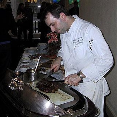 Shelly's New York's executive sous chef Holger Strutt sliced sirloin for guests at the reception.