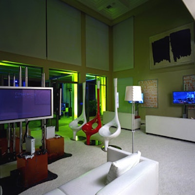 Indoors, highly stylized space-age furniture from Modern Props included ladle-shaped chairs in red and white.