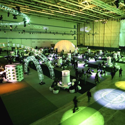 Guests placed their event-issued beanbag chairs in front of hundreds of high-definition monitors throughout the hangar to make use of 500 new Xboxes.
