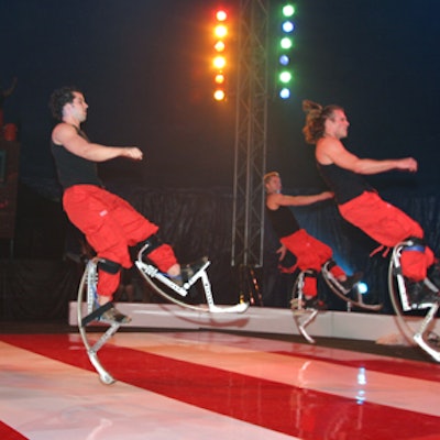 Acrobats performed stunts on the red-and-white-striped, custom-created dance floor.