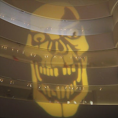 Stortz Lighting projected a large yellow skull and other illuminated creatures on the walls of the Solomon R. Guggenheim Museum for the museum's Halloween ball.