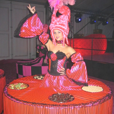 Models in the center of strolling dessert tables served sweets to guests in the after-hours nightclub tent.