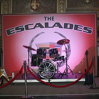 Cadillac sponsored a photo op area where guests could don glam rock costumes and pose with two electric guitars, a microphone, and a drum kit. The resulting photographs mimicked rock music album covers, with a faux band name, 'The Escalades,' emblazoned across the top.