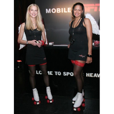 Models in black skirts and tanks tops, roller skates, red garters, and white angel wings promoted ESPN Mobile cell phones.
