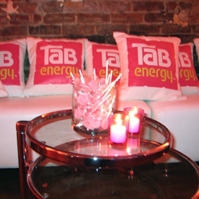 Jars of pink lollipops (with sticks that read 'Fuel to be fabulous') and throw pillows jazzed up seating areas.
