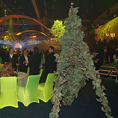 Entertainment included stiltwalkers in vinelike costumes.
