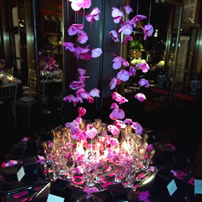 Harry Slatkin of candle firm Slatkin & Company created a luscious cascade of purple orchids that hung at various lengths—including strands that ran onto and over the table.