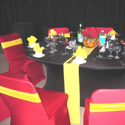 Tables were covered with red, yellow, and black spandex and topped with bright centerpieces that held orange slices and jalape?os.