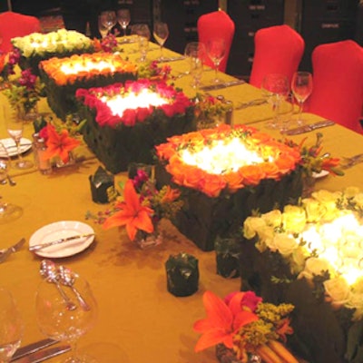 At WEDU's first Sojourn fund-raiser, tables were dressed in gold spandex and topped with multiple rose boxes.