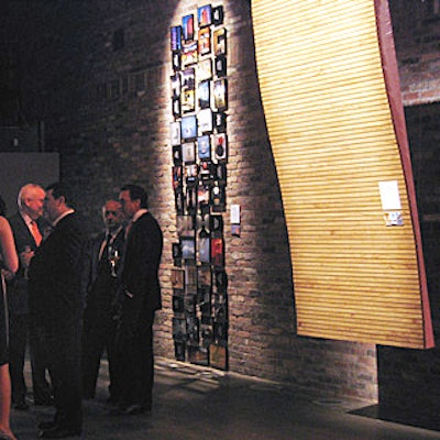 The best public space winner, the Terminal T4 at the Madrid Barajas International Airport, was represented by a panel of bamboo-clad steel—the same material as the terminal's ceiling. Pictures of interior and exterior of the Puerta América in Madrid, winner of the best large hotel award, hung in a collage next to it.