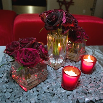 For the post-awards dessert reception, Van Vliet & Trap covered cocktail tables with gray linens topped red roses and a layer of gravel.