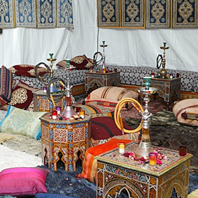 Sweet tobacco smoke filled a hookah tent, along with rugs, stools, throw pillows, and tables that made imbibing more comfortable.